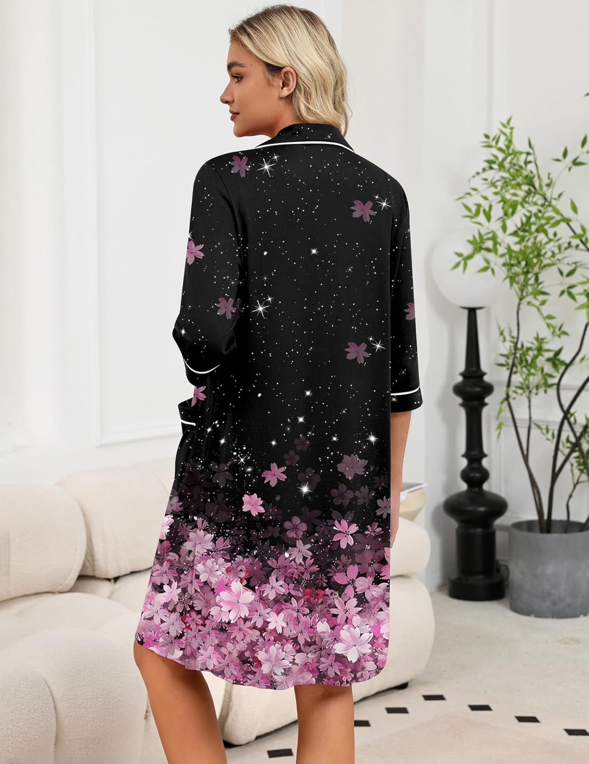 Black back view zip robe with pink floral hem and star speckles, 3/4 sleeves.