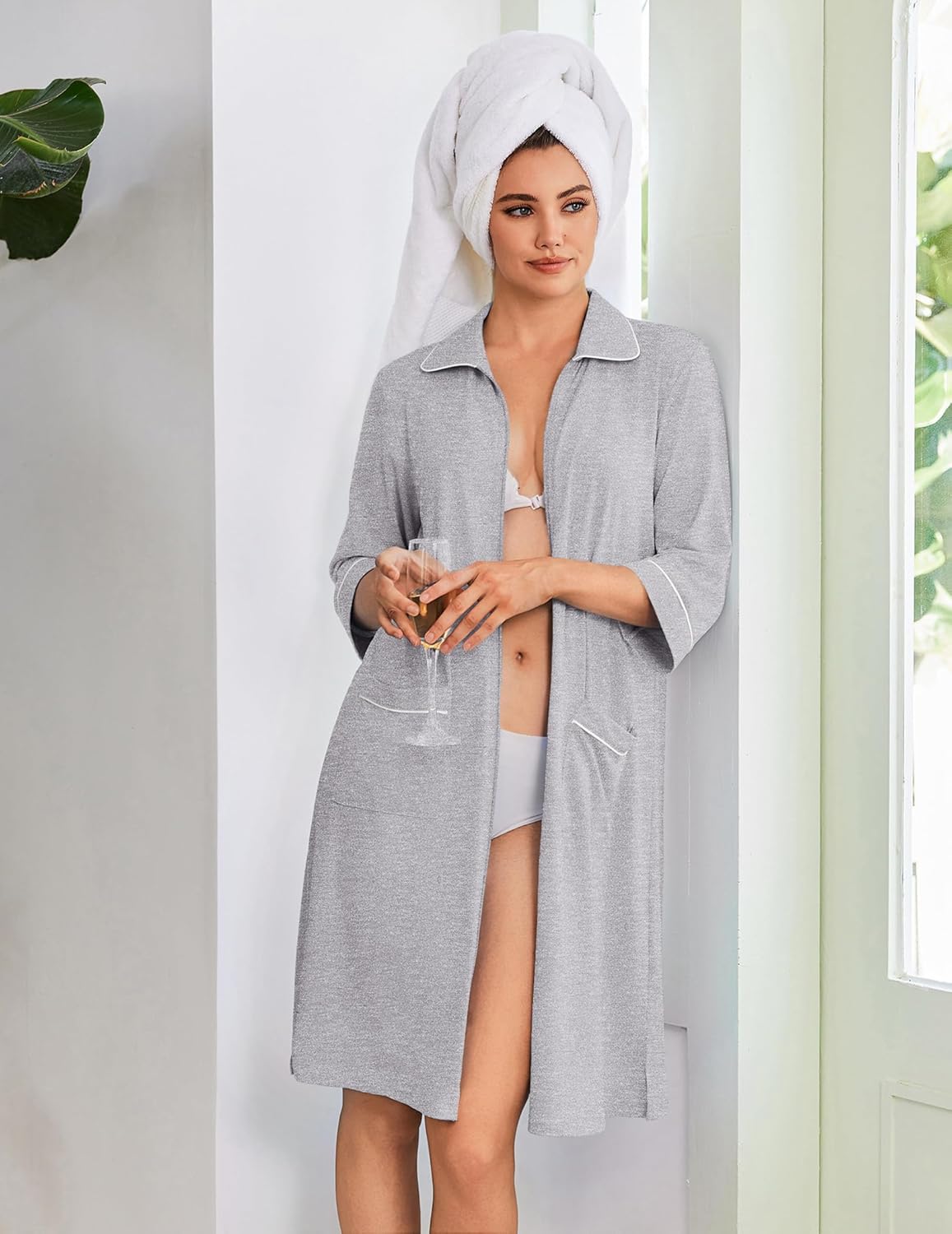 Grey zip robe with white trim, pointed collar, 3/4 sleeves, front pockets