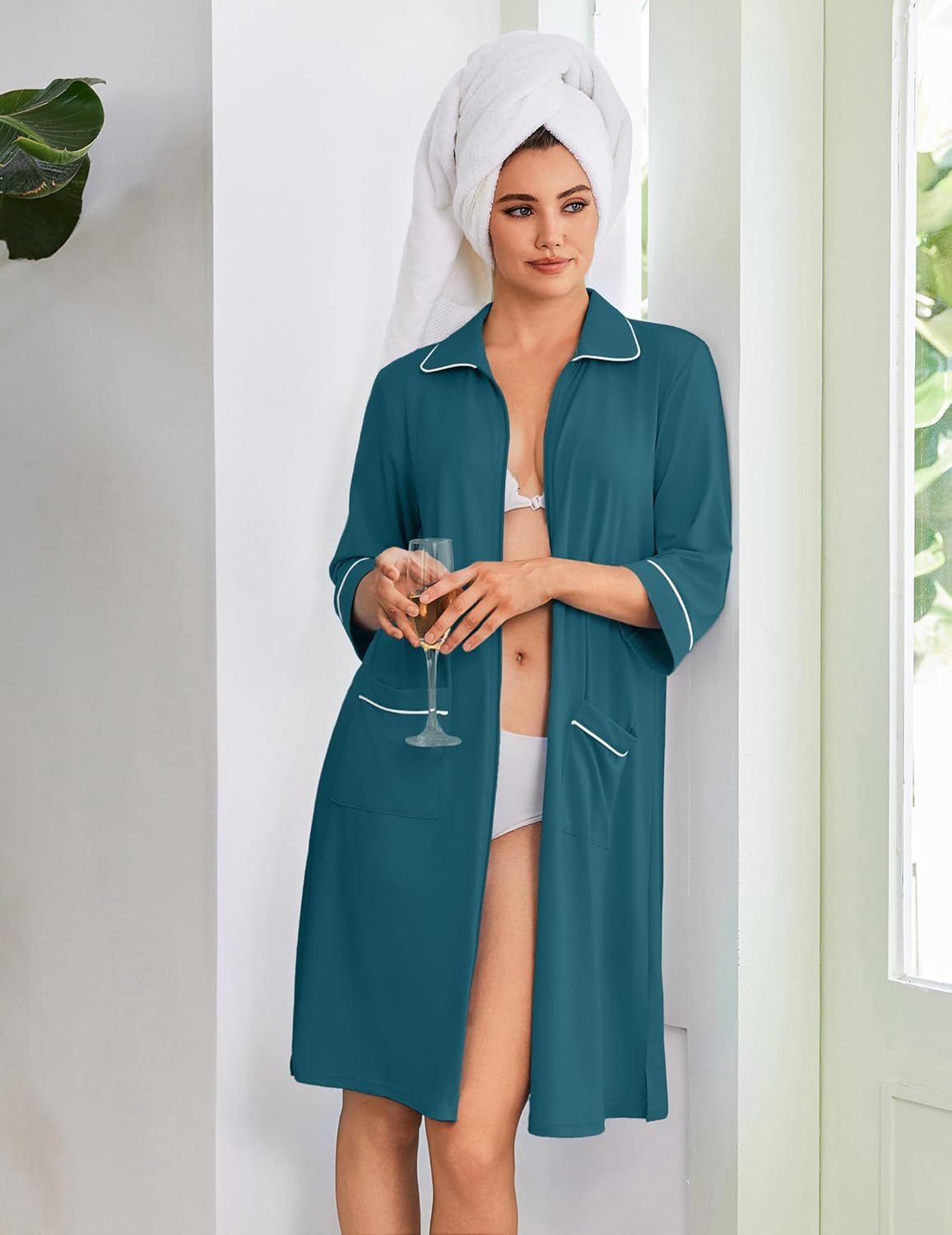 Teal zip robe with white piping, pointed collar, 3/4 sleeves, front pockets