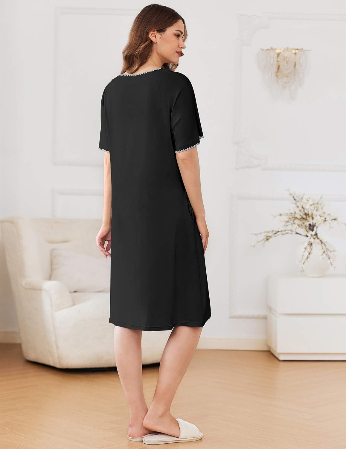 Knee-length zipper robe in black, back view with short sleeves and clean straight hem.