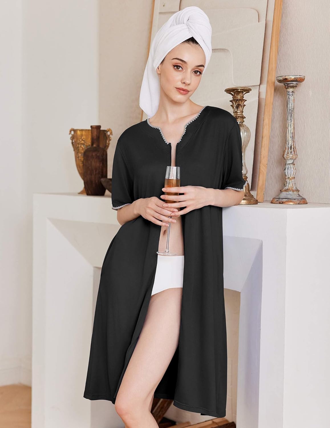 Knee-length zipper robe in black, open front with short sleeves and zipper neckline.
