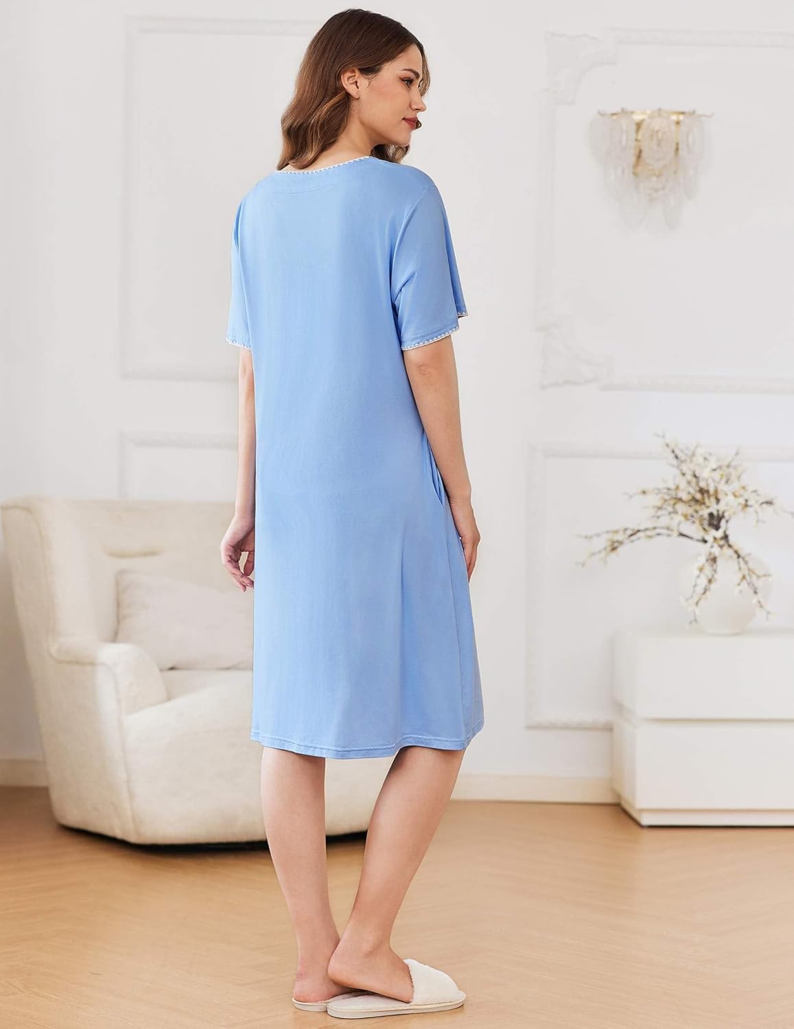 Knee-length zipper robe in light blue, back view with short sleeves and straight hem.