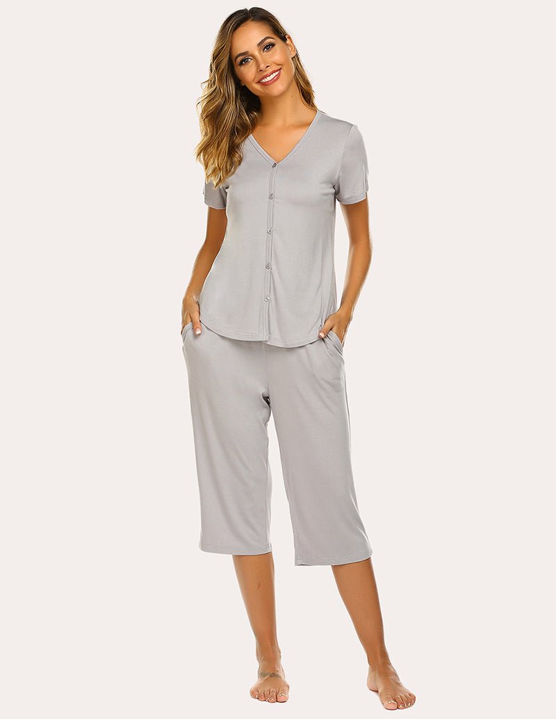 Light grey V-neck button-up pajama top and capri pants set, front view