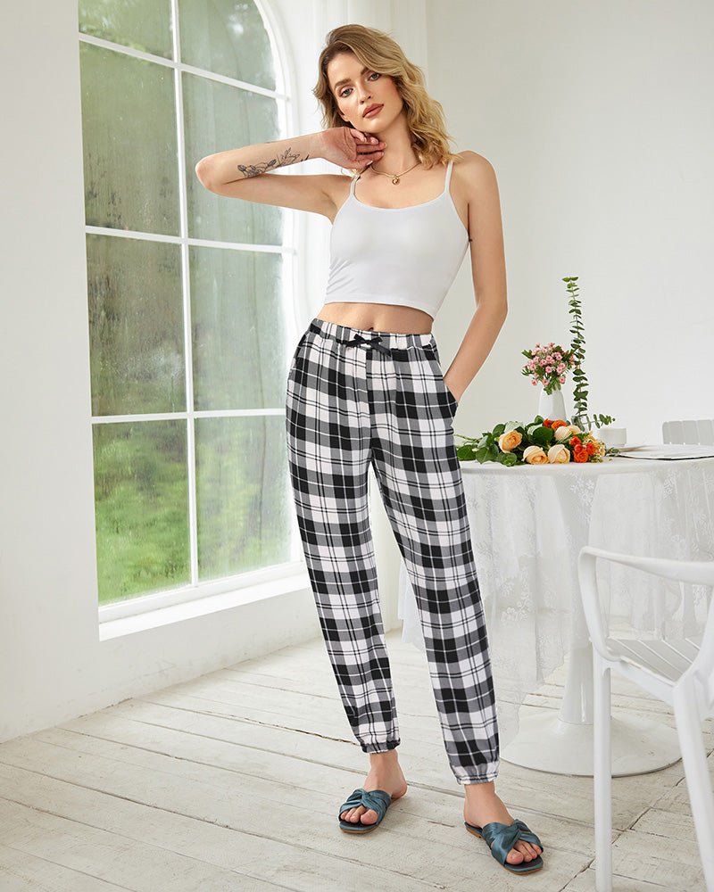 Black-and-white plaid lounge pants with drawstring waistband and elastic ankle cuffs