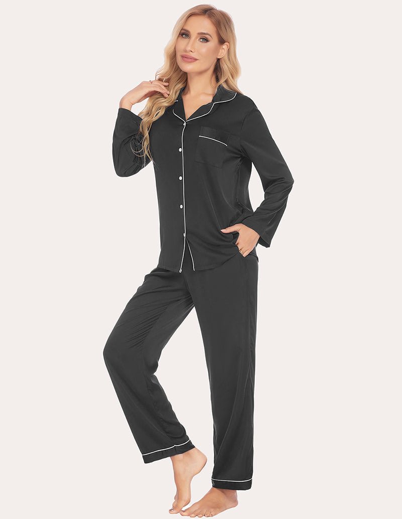 Black satin pajama set with contrast piping, button-up shirt and cuffed pants