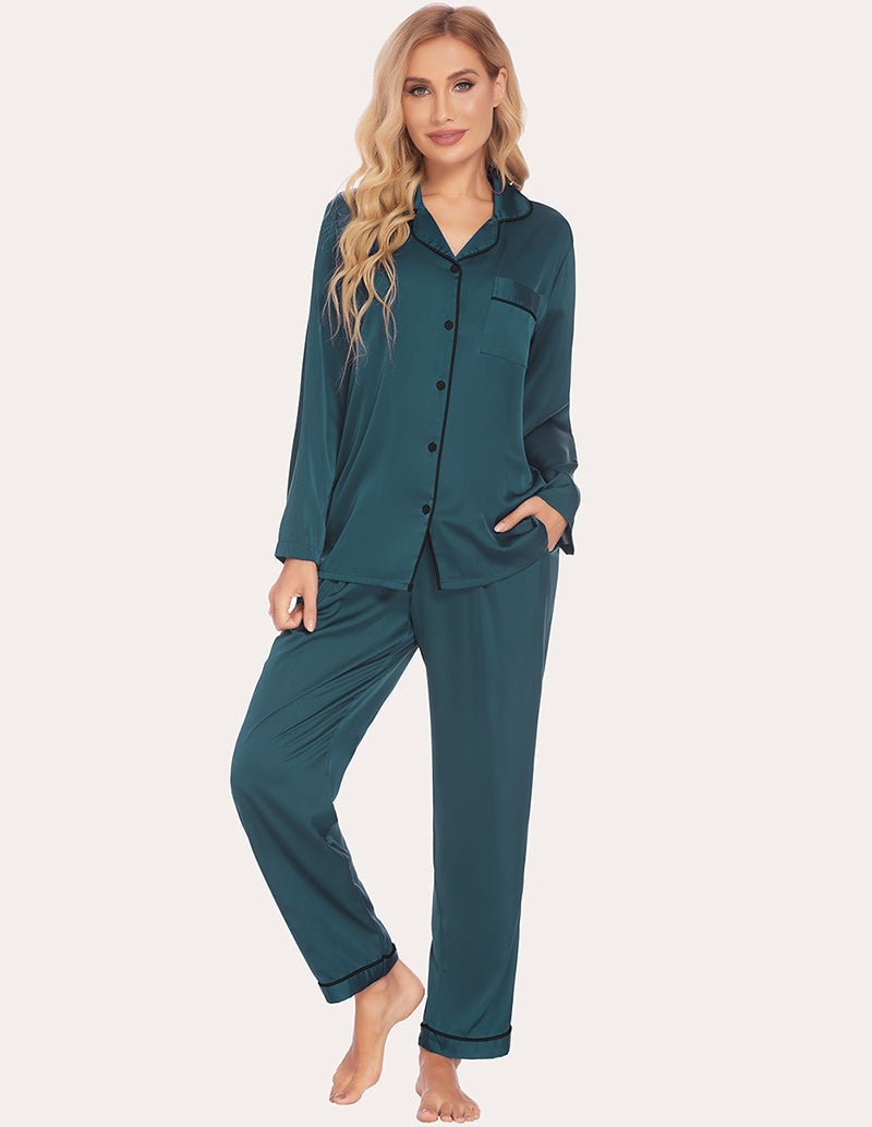 Dark green satin pajama set with button-up top, chest pocket, and tapered pant cuffs