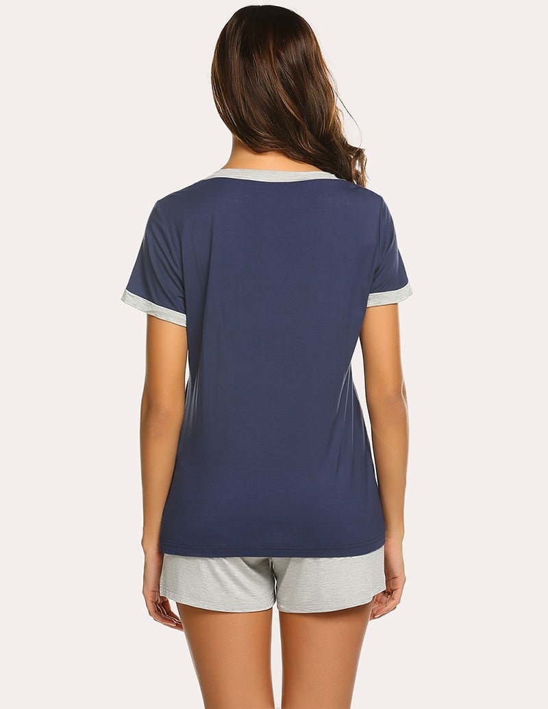 Back view of navy pajama top with contrast neckline and gray lounge shorts