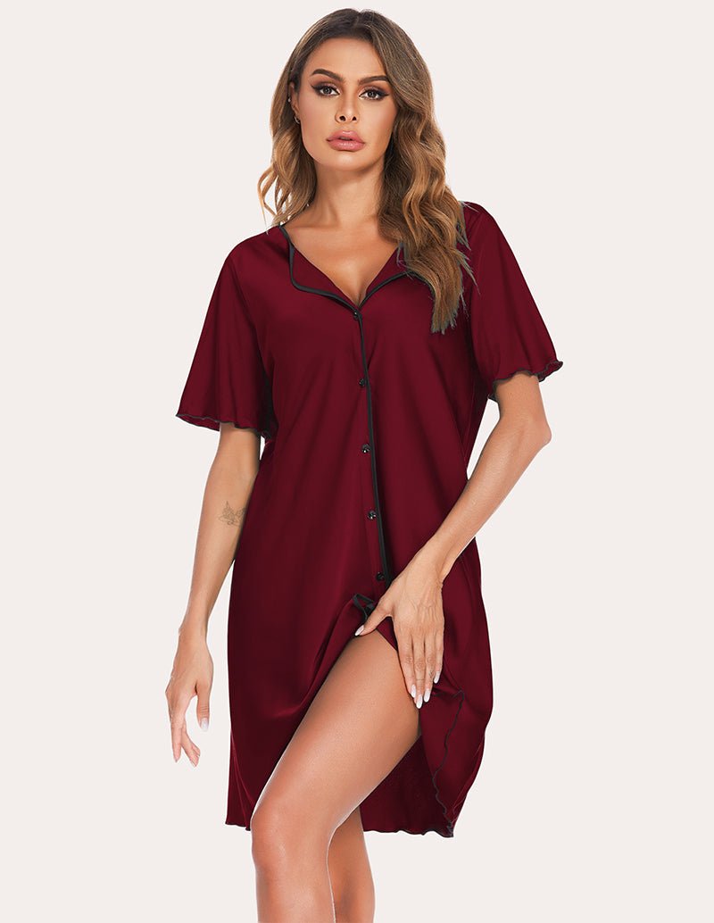 Satin sleep dress in wine red with V-neck, button front, black piping trim, and side slit