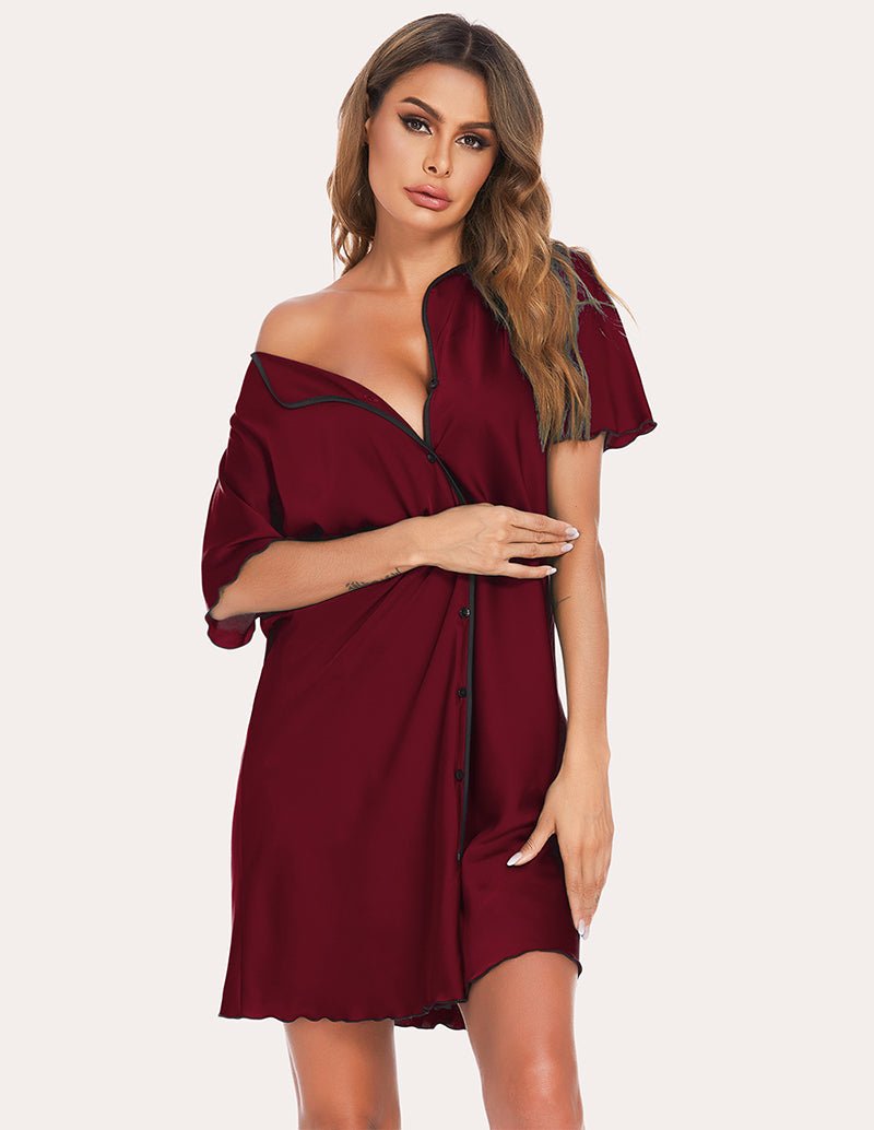 Satin sleep dress in wine red with V-neck, button front, black piping trim, and relaxed short sleeves