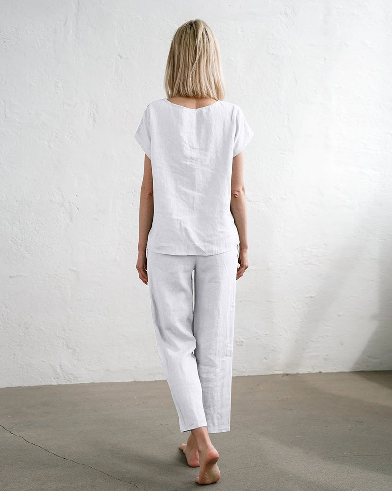 White 2-piece pajama set with short-sleeve top and ankle-length drawstring pants