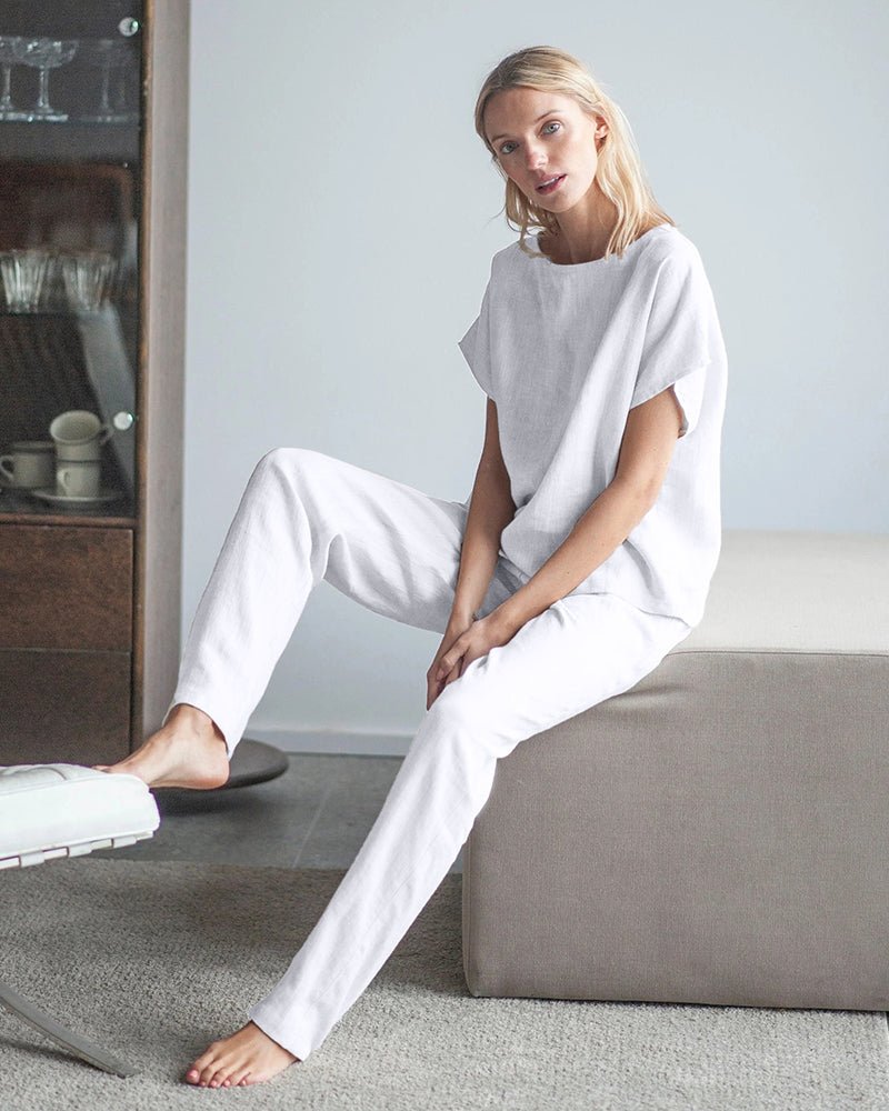 White 2-piece pajama set with short-sleeve shirt and drawstring ankle pants