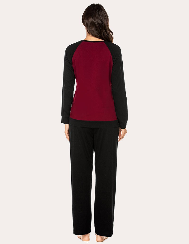 Women’s cotton pajama set from back view: long-sleeve V-neck top and black pants