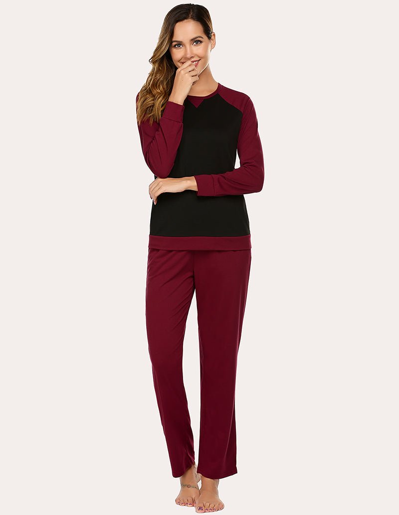 Cotton pajama set with long-sleeve top and straight-leg pants, wine red with dark contrast panels.