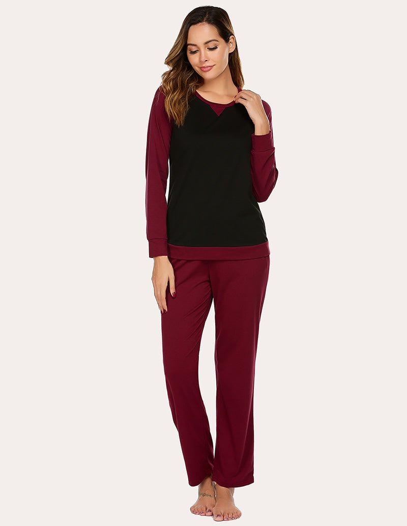 Cotton pajama set with long-sleeve raglan top and matching drawstring pants, dark and wine red.