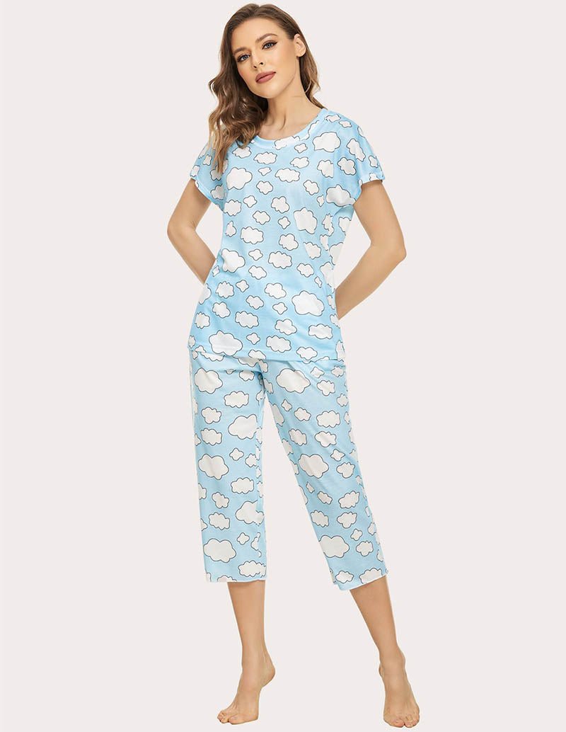 Cropped pajama set in light blue with white cloud print; front view, short-sleeve top and capris.
