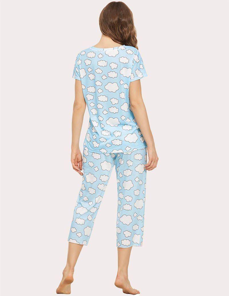 Cropped pajama set in light blue with white cloud print; back view, short-sleeve top and capris.