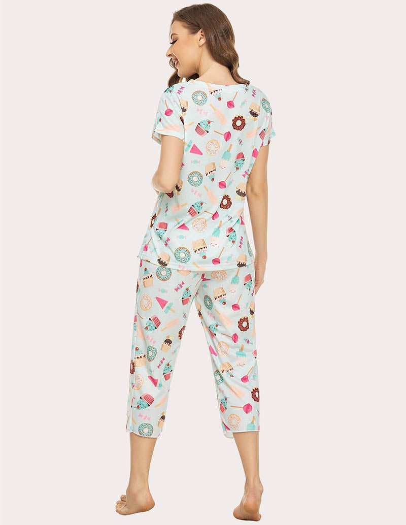 Women’s cropped pajama set back view; white with colorful food print, capri pants