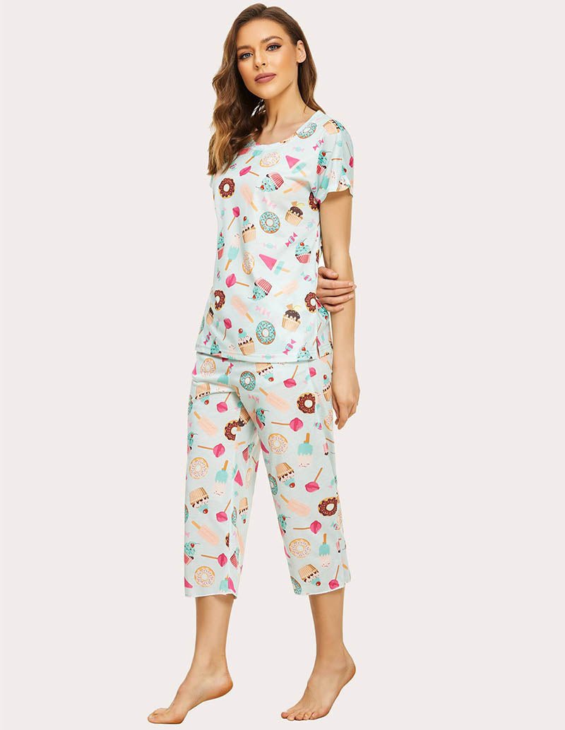 Women’s cropped pajama set in white with colorful food print, short-sleeve top and capri pants