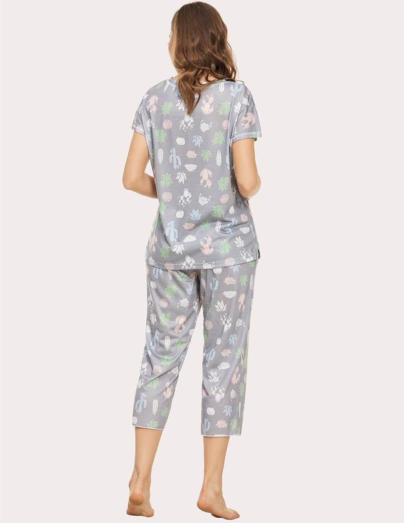 Cropped pajama set in grey with multicolor animal print; back view of short-sleeve top and capris.