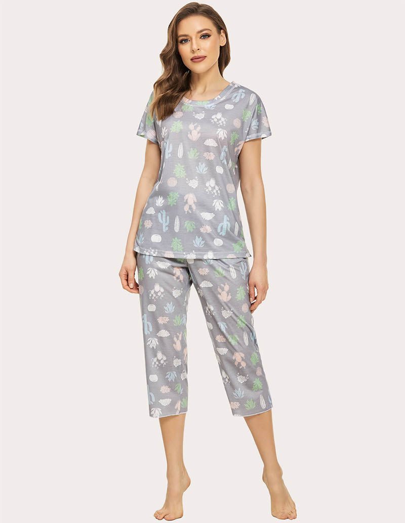 Cropped pajama set in grey with multicolor animal print; short-sleeve top and capri pants.
