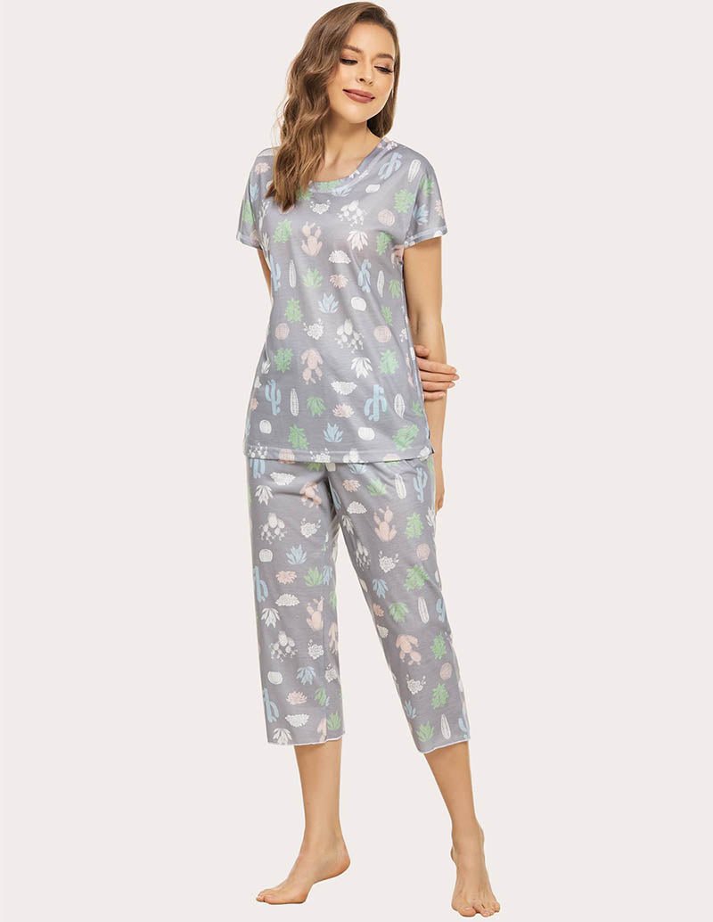 Cropped pajama set in grey with multicolor animal print; short-sleeve top and capri pants, side view.