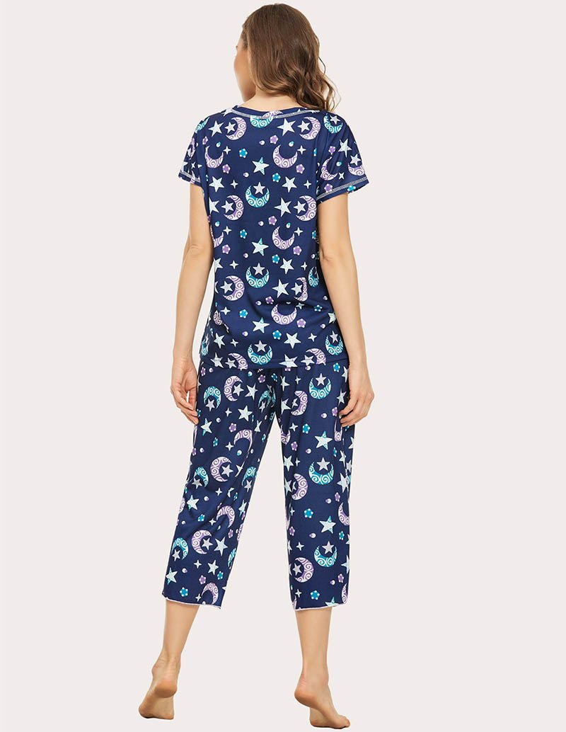 Back view navy blue star and moon print cropped pajama set, short sleeves and capri pants