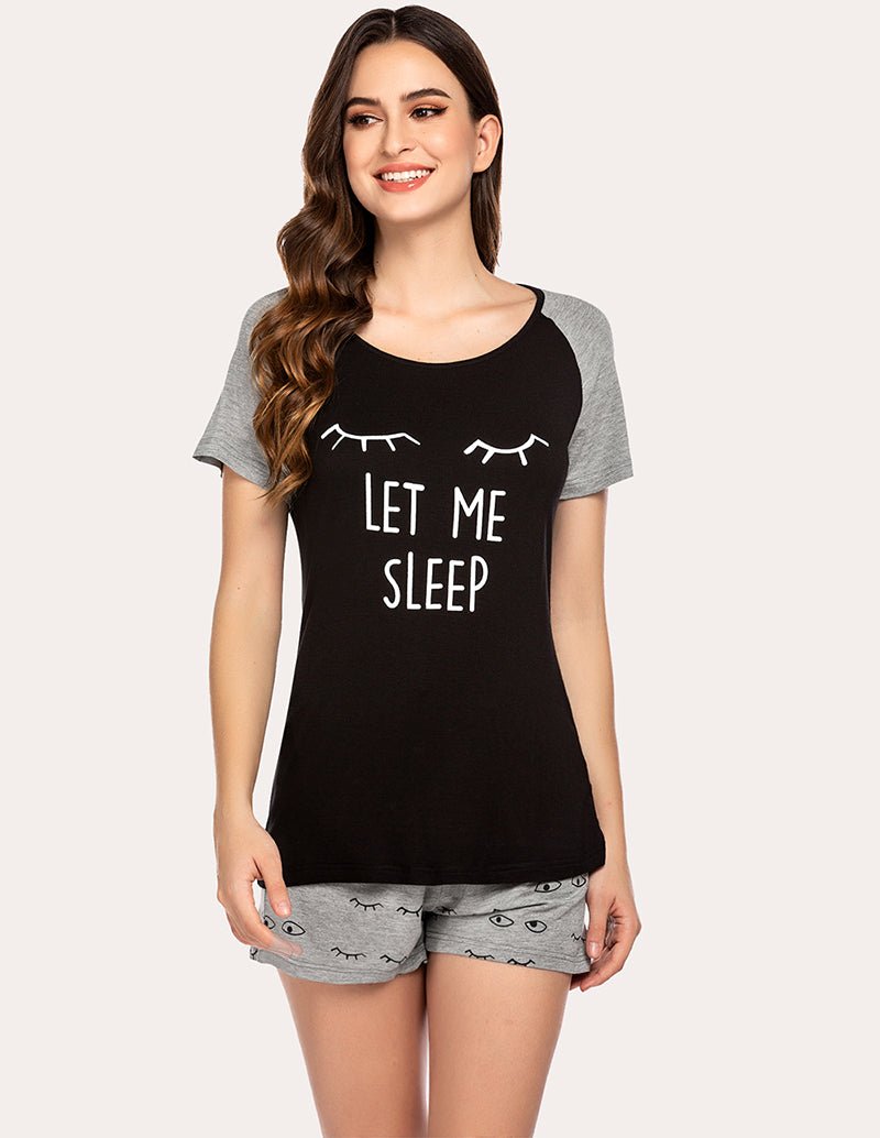 Women's black pajama set with 'Let Me Sleep' top and matching gray printed shorts