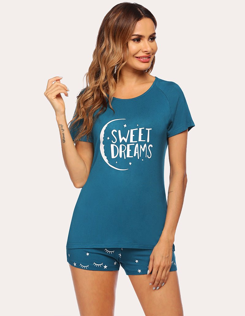 Women's peacock blue pajama set with 'Sweet Dreams' graphic top and patterned shorts