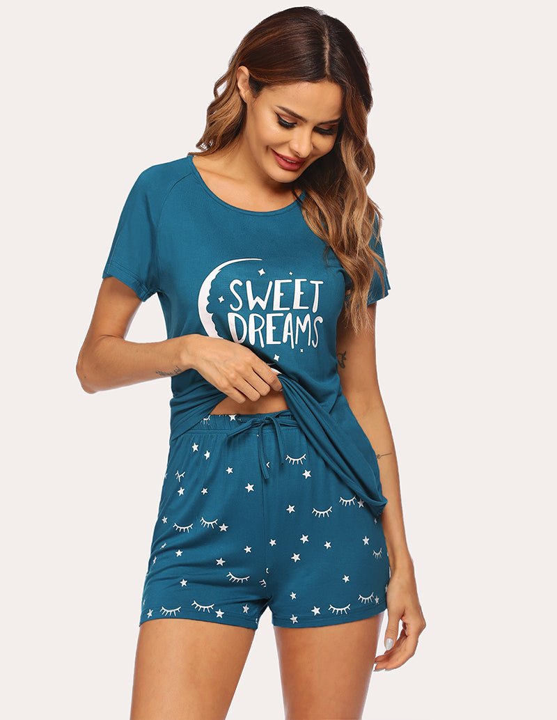 Women's peacock blue pajama set with 'Sweet Dreams' top and star-and-lashes shorts