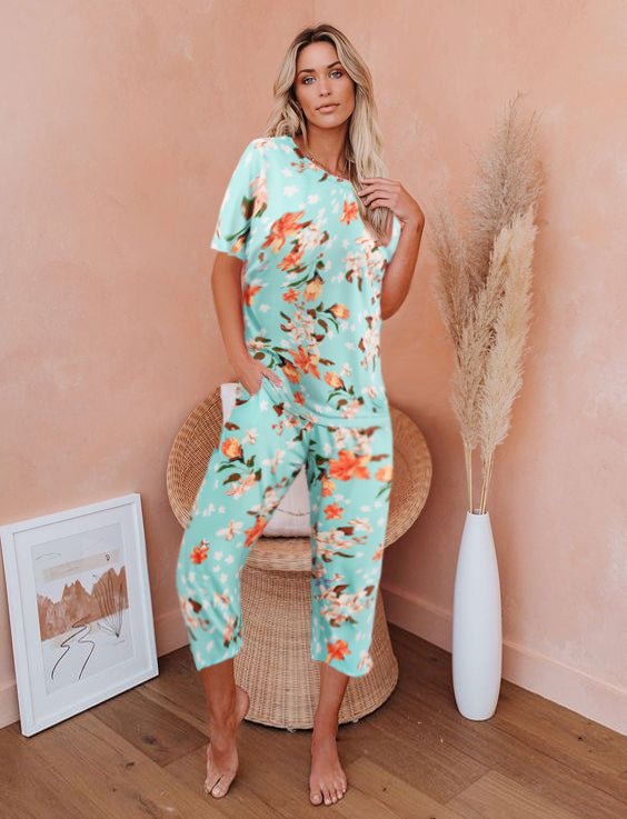 Teal floral pajama set with short sleeves and cropped capri pants, side pockets