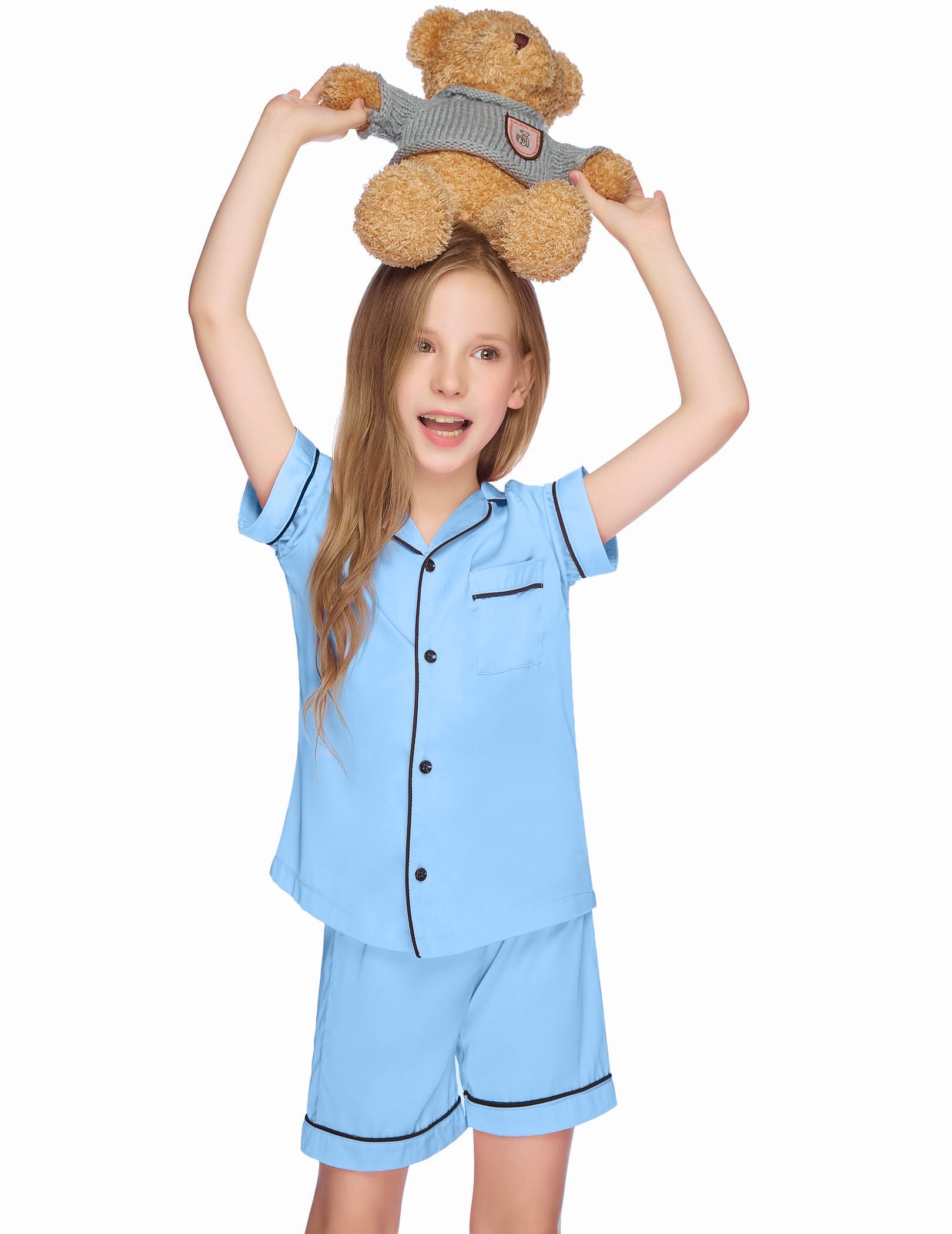Kids satin pajama set in light blue with short-sleeve button-up top and matching shorts.