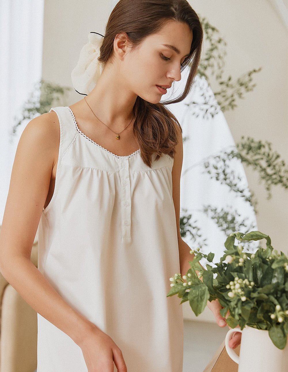 White lace-trim nightdress close-up, gathered bodice and scalloped neckline