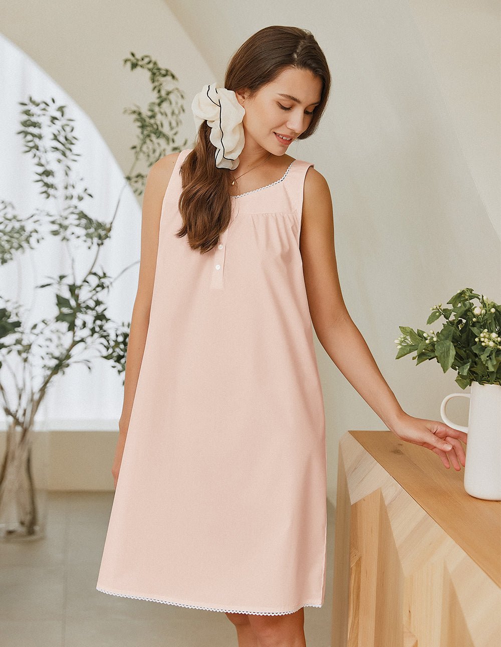 Pink lace-trim nightdress with sleeveless scoop neckline and gathered front