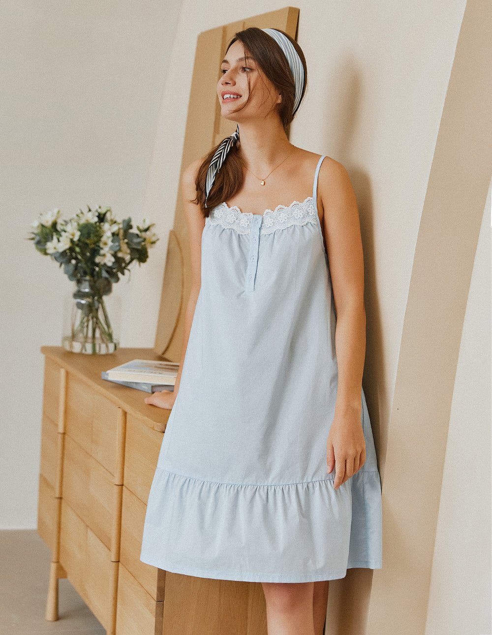 Light blue lace-trim nightdress with button front and tiered hem, spaghetti straps