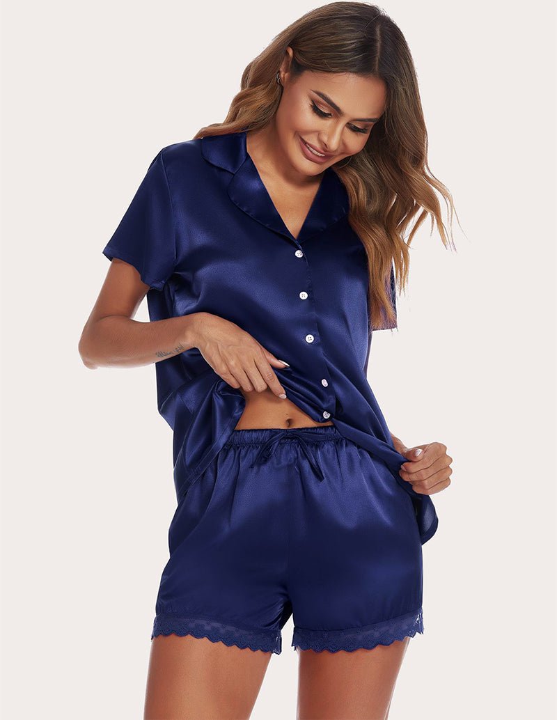 Navy satin pajama set with button-front blouse and lace-trim shorts, drawstring waist