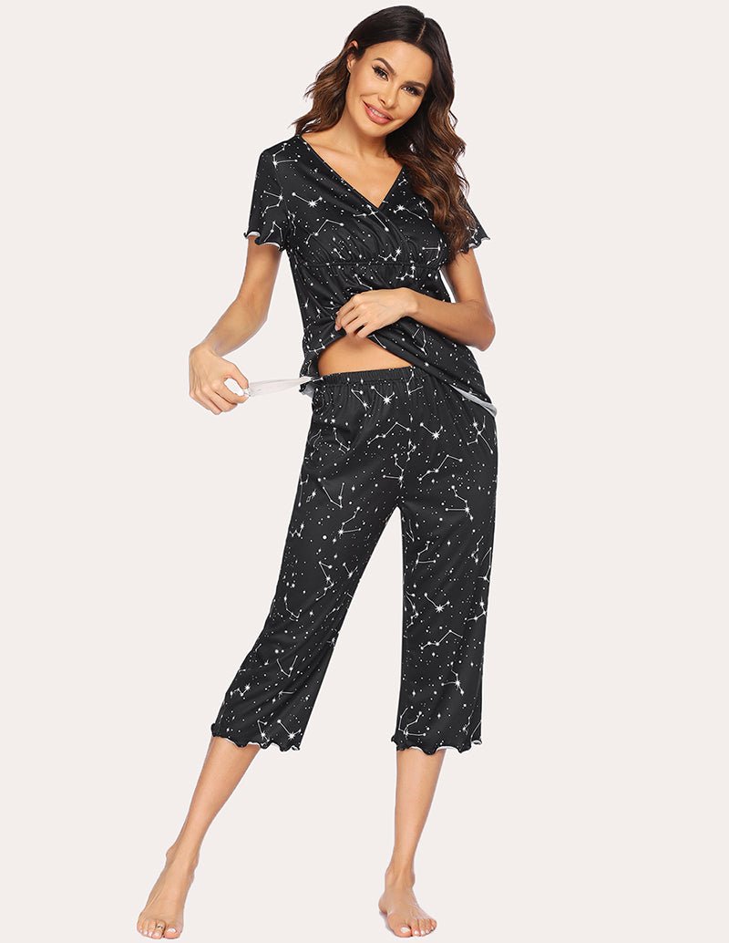 Maternity nursing pajama set in black with white star-like print, V-neck nursing top and capri pants