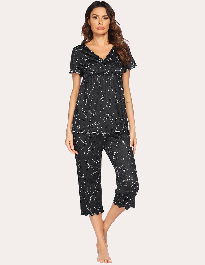Maternity nursing pajama set in black with white star-like print, V-neck top and capri pants