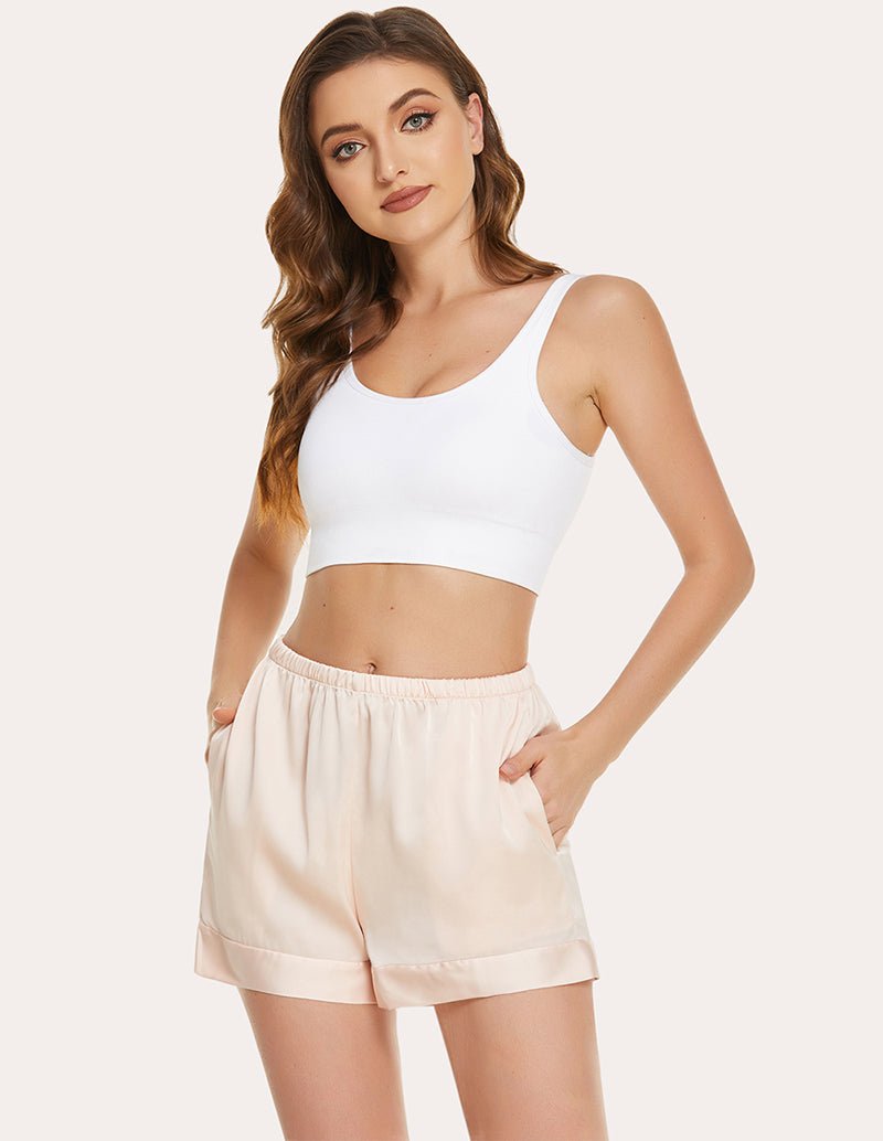 Light cream pajama shorts with elastic waistband and relaxed, airy fit
