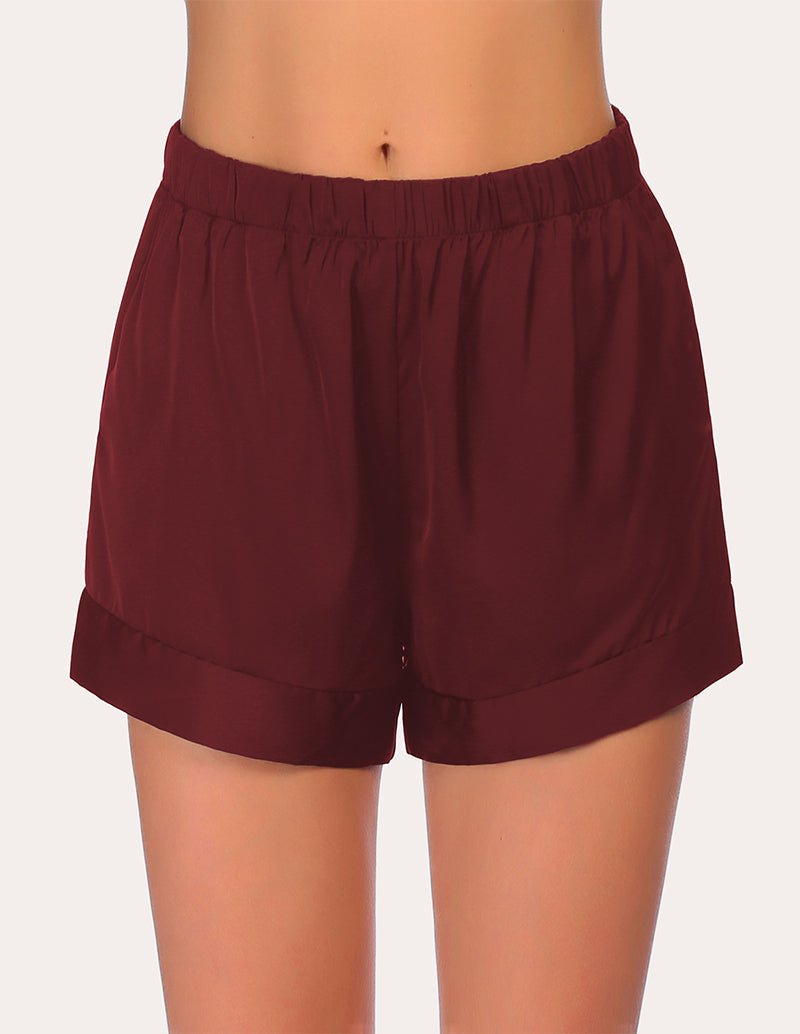 Loose pajama shorts in wine red with elastic waistband and relaxed, straight legs.