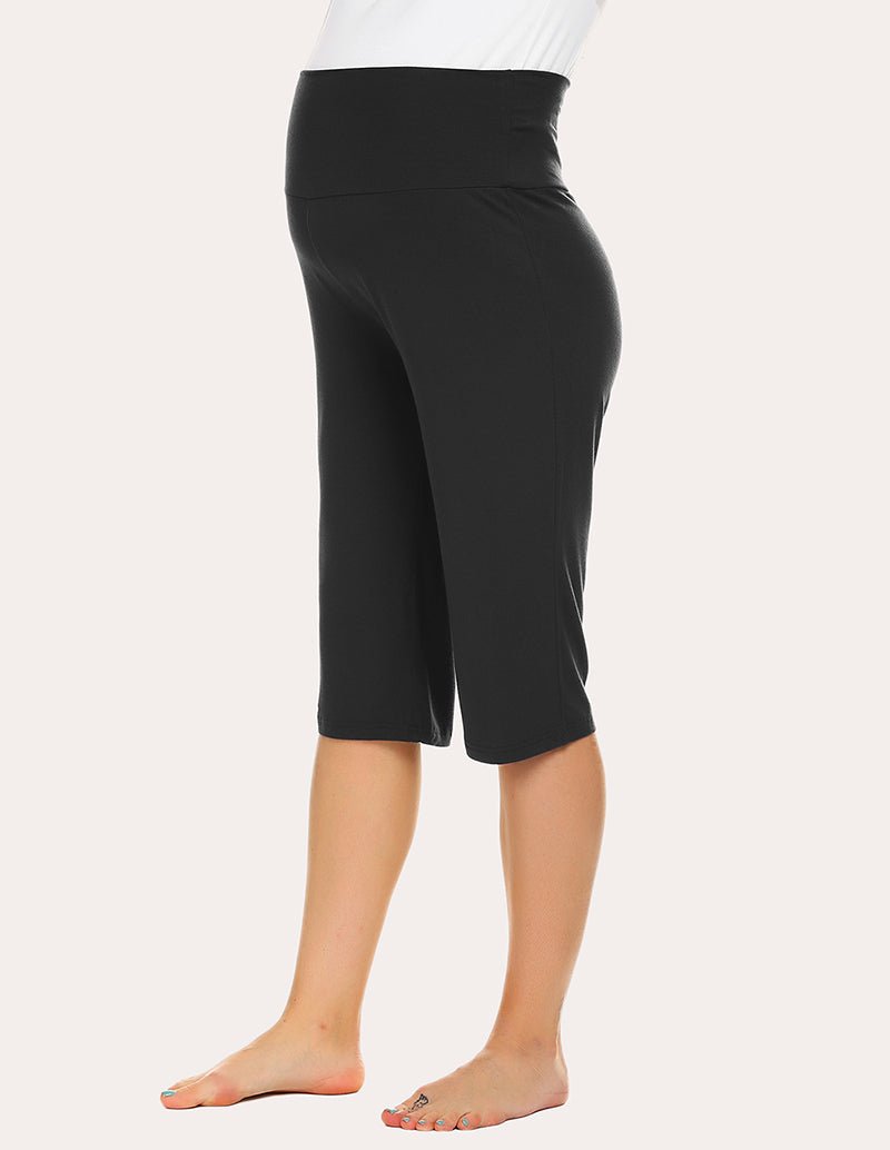 Maternity capri pants in black with elastic waist and draped straight leg design