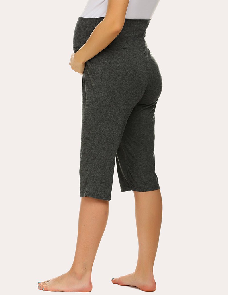 Maternity capri pants in dark green with side view, mid-calf elastic waist