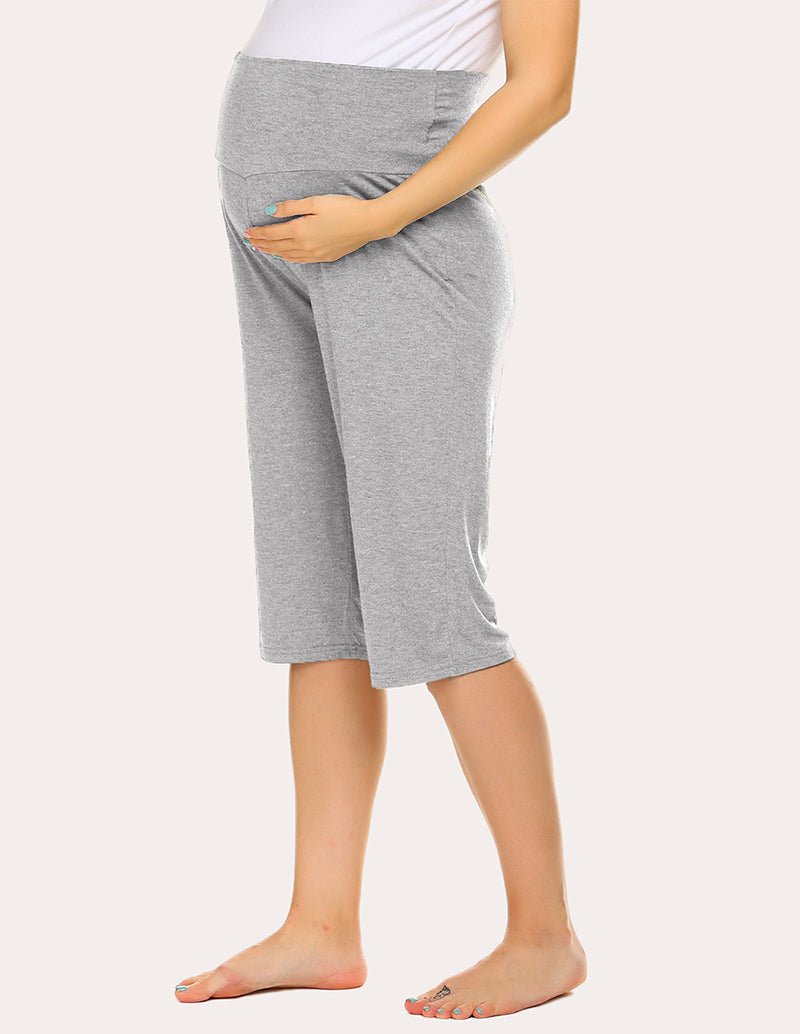 Maternity capri pants in light grey, front view with stretchy maternity band