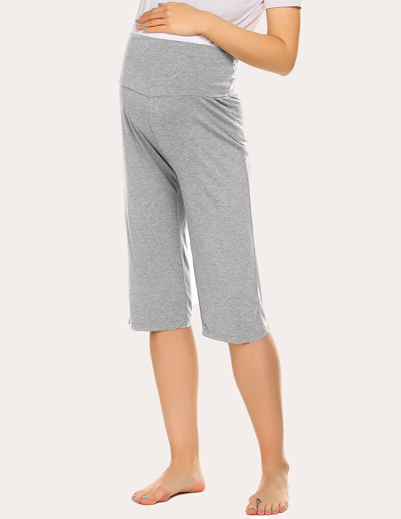 Maternity capri pants in light grey, side view with mid-calf elastic waist