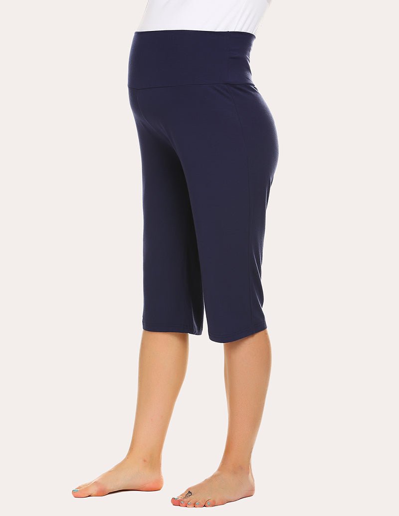 Navy maternity capri pants, side view with elastic waist and knee-length hem