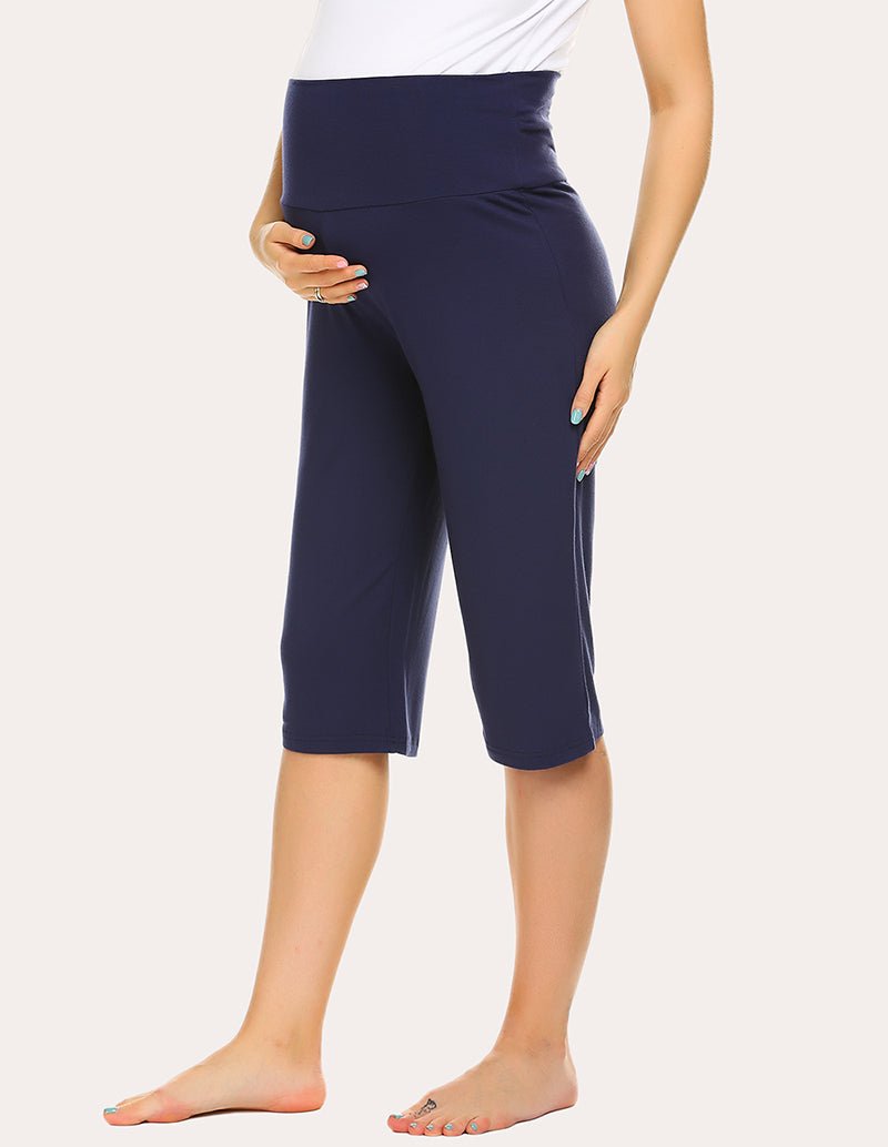 Navy maternity capri pants with supportive belly panel, front view