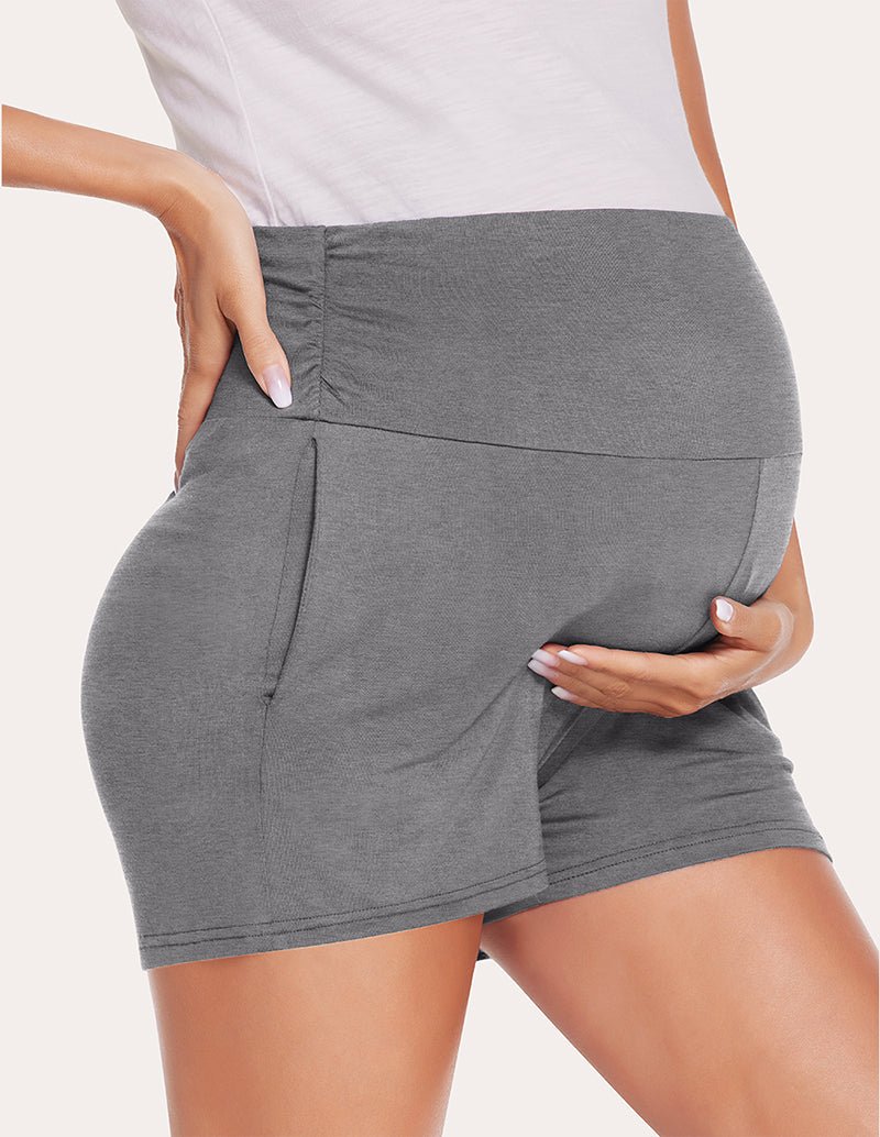 Dark grey maternity shorts, side view showing front pocket seam line