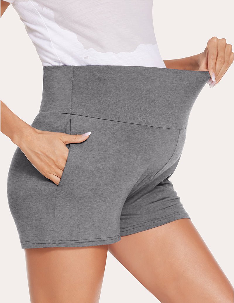 Dark grey maternity shorts, close-up of curved tummy panel edge