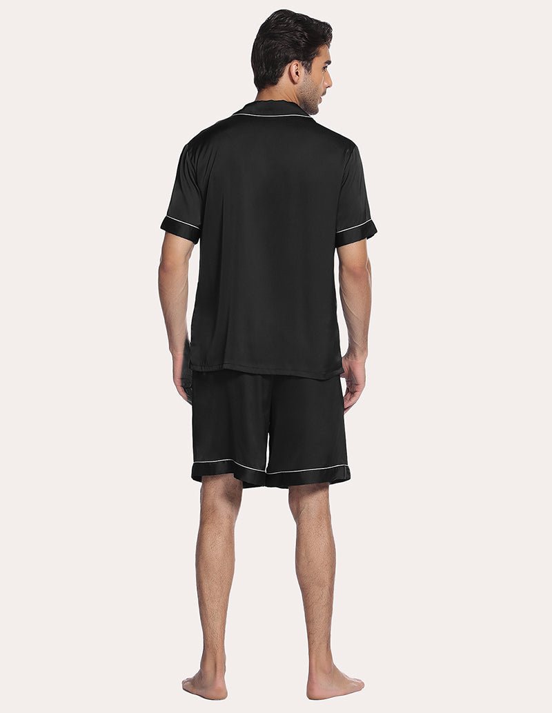 Black men’s satin pajama set, back view of short-sleeve button shirt and knee-length shorts
