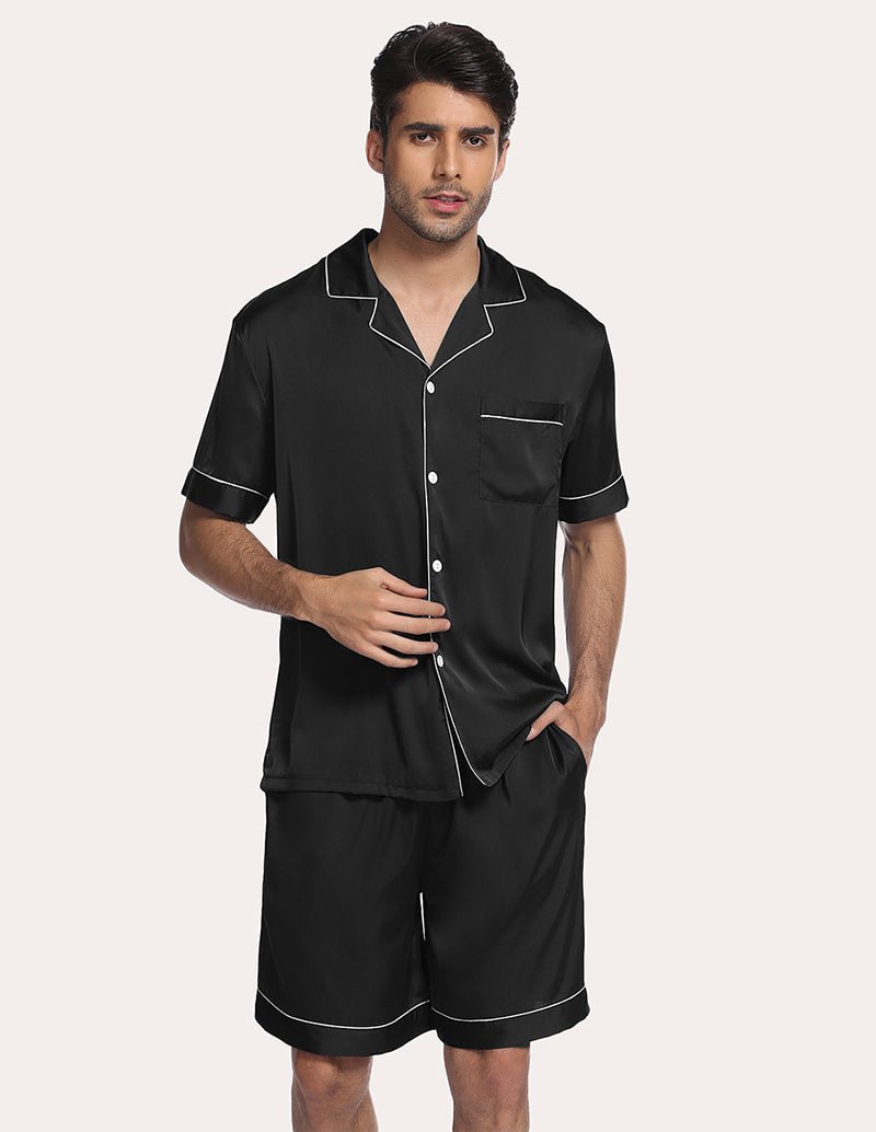 Men’s black satin pajama set, front view with button-up shirt and matching knee-length shorts