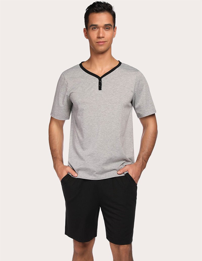 Men's gray short-sleeve pajama top with black drawstring shorts set